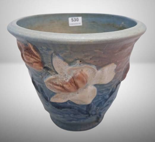 Roseville Magnolia 666-5" Flower Pot, blue: Roseville Pottery flower pot in the Magnolia pattern, featuring embossed white magnolia flowers on a blue background. Marked "?Roseville, U.S.A., 666-5" on the base. Displays minor wear, consistent wi