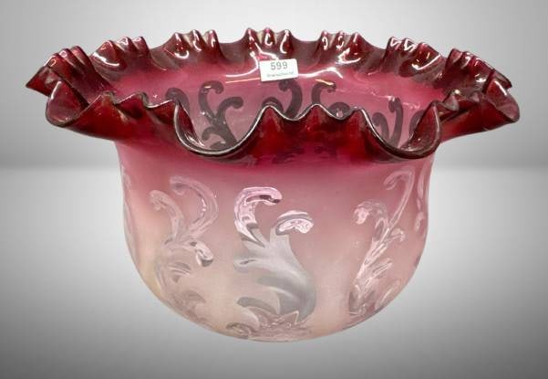 Victorian-Era Glass Oil Lamp Shade: Victorian-era glass oil lamp shade with cranberry-colored glass with an etched or acid-etched decorative floral design. Measures 5" tall, with a 4" base diameter and 8.25" top diameter. Features a sma