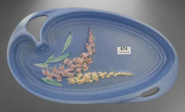 Roseville Foxglove 420-10" Blue Tray: Roseville Pottery Foxglove pattern tray, model 420-10", in blue glaze. Features pink and yellow floral relief. Measures approximately 10 inches long. Marked on base 'Roseville U.S.A. 420-10'. No chips