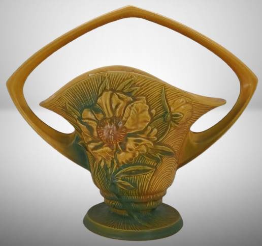 Roseville Peony 379-12" Basket, yellow: Roseville Pottery Peony 379-12" basket in yellow glaze. Features raised floral design with a double-handle arch. Marked 'Roseville U.S.A. 379-12"' on the bottom. Note: Chip present on the bottom edge.