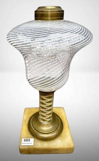 Kerosene Lamp with Glass Shade: Kerosene lamp featuring a white swirl glass font, brass fittings, and a square marble base. The intricate design and materials suggest vintage craftsmanship. The lamp measures approximately 9" in heig