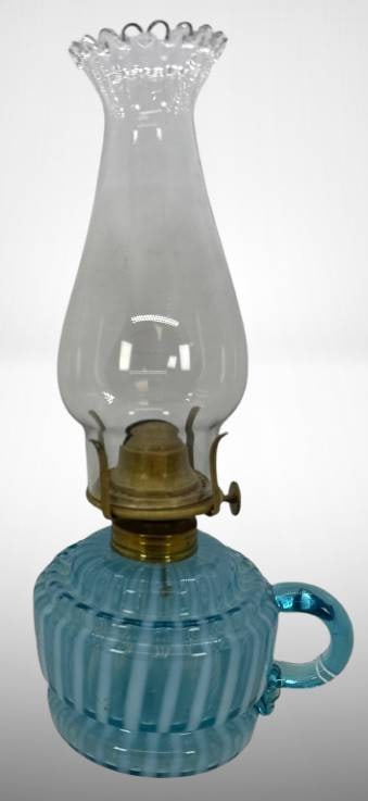 Blue Opalescent Glass Kerosene Lamp with Brass Burner: Blue opalescent Striped pattern miniature kerosene lamp featuring a clear glass chimney and brass burner. The lamp includes a handle for portability. Measurements provided in the images, with evidence