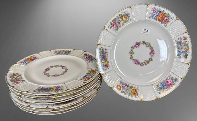 8 Rosenthal Bavaria Dinner Plates: Eight Rosenthal Bavaria 10"d dinner plates featuring floral garlands in the center and floral panels with textured lattice patterns on the rims. Each plate is marked on the underside. Elegantly accent