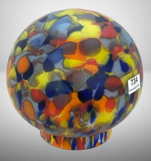 Colorful Glass Lamp Shade With Abstract Design: Glass lamp shade featuring a vibrant abstract design with multicolored patterns in shades of blue, yellow, red, and orange. Round shape with an open base. Dimensions are shown with a ruler for scale.