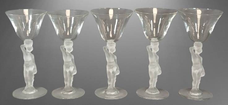 Bayel France Bacchus Nude Stemmed Goblets: Five Bayel France stemmed cocktail 6.5" goblets featuring frosted glass nude Bacchus stems. The bowls and bases are clear glass. Each goblet showcases intricate details. Noted for their elegant design
