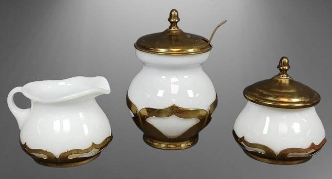 Farber Brothers White Milk Glass Set with Brass Trim: Three-piece set by Farber Brothers featuring white milk glass with solid brass trim. Includes sugar bowl with lid, creamer and covered condiment jar with spoon. ? Marked "Solid Brass by Farber Brother