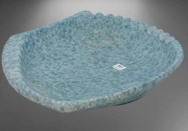 Roseville Capri 599-13" Blue Ashtray: Roseville Capri 599-13" ashtray in a blue and white textured glaze. Features a unique, asymmetrical design. Includes a chip on the bottom rim, as shown in photos.