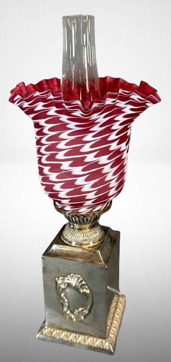 Nailsea Shade on Walker & Hall Silversmith"s Base: Oil lamp featuring a cranberry and white Nailsea glass shade with ruffled edges, set on a silver-plated base stamped "Walker & Hall, Sheffield, England, 51262A." Includes chimney and decorative elemen