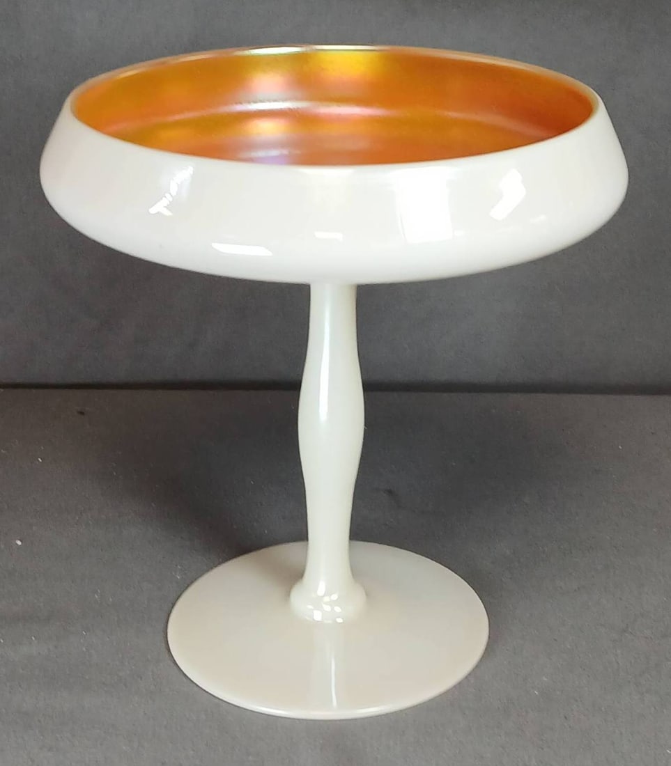Steuben Gold Aurene Calcite Compote: Steuben Art Glass 6" tall compote featuring a gold aurene interior with a calcite exterior. Designed with a pedestal base and elegant proportions. Known for its iridescent finish, reflective of Steube