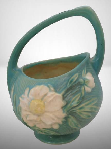 Roseville Peony 376-7" Basket, Green : Roseville Peony Basket in green glaze with raised floral design and arched handle. Marked on the base with "Roseville U.S.A." and shape number "376-7". The basket is well-preserved with minor wear con