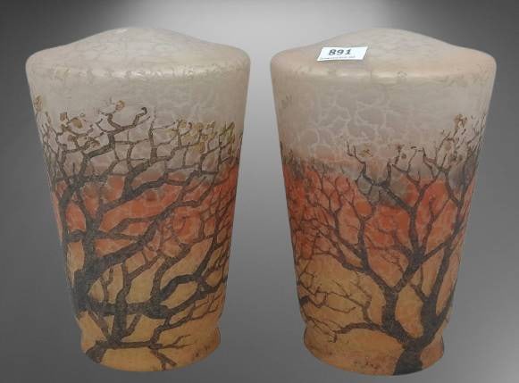 Handel 2909 Tree Motif Lampshades: (2) Glass lamp shades signed ‘Handel’ and marked ‘2909.’ Features a tree motif in warm autumnal tones. Small chips are present on the bottom rim of one shade. Refer to detailed photos for cond