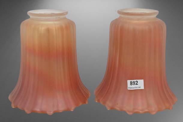 Vintage Nuart-style Carnival Lamp Shades: Nuart-style Carnival lamp shades featuring a ribbed design and iridescent marigold tones with subtle gradient transitions. Each shade has a circular opening at the top for mounting, and the bases flar