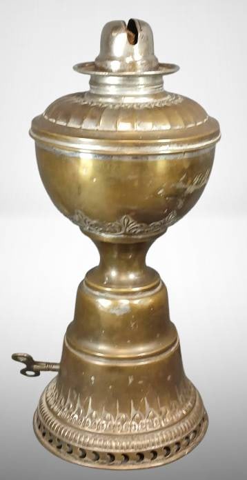 Improved Hitchcock Lamp, Brass and Metal: Improved Hitchcock Lamp made of brass and metal with decorative detailing. Features an intricate burner assembly and marked with patent information on the burner. Exhibits several scuffs and dents, vi