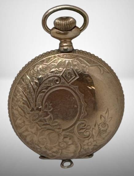 Gold-Filled Waltham Pocket Watch: American Waltham Watch Co. pocket watch featuring a gold-filled case with intricate floral engraving. Marked "Victory" and "10 years warranted" on the interior. Non-functioning mechanism. Approximatel