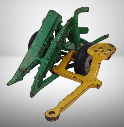 Arcade Corn Binder Toy With Original Paint: Arcade Corn Binder toy with original paint. Cast iron construction with green and yellow detailing. 5 inches long, includes rubber tires marked 'Arcade Balloon' and intact 'Arcade Toy Made in USA' lab