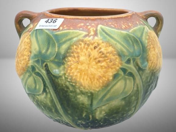 Roseville Sunflower 4" Bowl Vase: Roseville Pottery Sunflower 4" bowl vase with handles. Features raised sunflower and leaf motifs in greens and yellows. Marked on the bottom. Excellent condition with no visible cracks or chips. In-ho