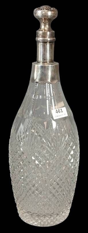 Cut Glass Decanter with Sterling Silver Stopper: Cut glass 12"h decanter featuring a detailed diamond and starburst pattern. Includes a mrkd. Sterling Silver stopper engraved with intricate floral motifs and collar. In good condition with stopper in
