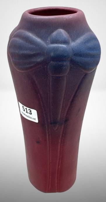 Van Briggle Dragonfly Vase: Van Briggle Dragonfly 7" vase in a two-tone mulberry and blue matte glaze, featuring a dragonfly motif in relief. Signed "Van Briggle U.S.A." on the base. In good condition with minor wear consistent