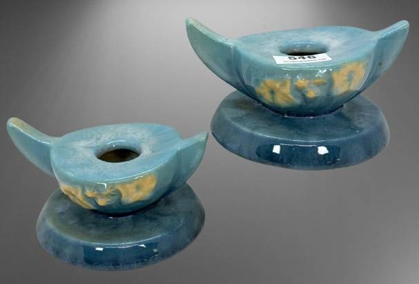 Roseville Wincraft 251 Blue Candle Holders: Roseville Wincraft 251 blue candle holders featuring a sculptural design and a glossy finish with yellow accents. Measures 2" tall. Good condition with no visible chips or cracks. In-house shipping av
