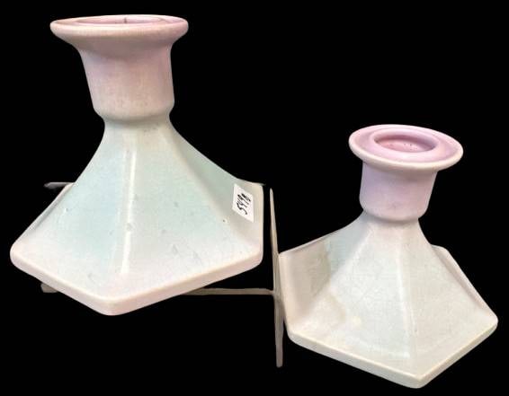 Weller Lavonia Candlesticks in Pastel Finish: Weller Lavonia 4"h candlesticks displaying a pastel, hexagonal design. No chips, cracks, or repairs noted, ensuring their preserved condition. Each piece is marked with ??Weller' on the base. A distin