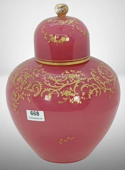 Art Glass Lidded Potpourri Vase: Art Glass lidded potpourri vase, 8.25 inches in height, dark rose finish featuring gold enamelled detailing. Inner rim wear, including gold wear and a small sliver from use of the lid. In-house shippi
