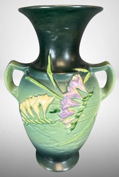 Roseville Freesia 127-12" Vase, Green: This Roseville Freesia 127-12" vase features a striking green glaze with raised floral motifs and a gracefully flared rim. Marked on the base. In excellent condition with no chips, cracks, or repairs