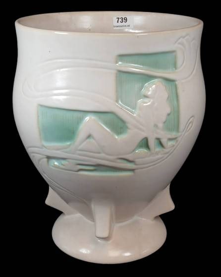 Roseville Silhouette 763-9" Nude Vase: Roseville Silhouette 763-9" Nude vase. Features a raised design with nude silhouettes on a pedestal form. White glaze with aqua accents. Repair at top rim, see photos. In-house shipping available.