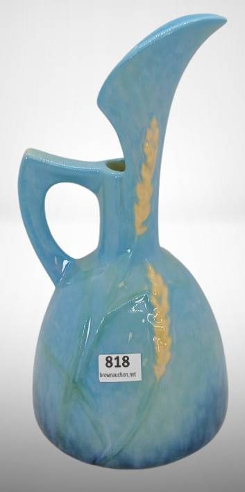 Roseville Wincraft 216-8" Blue Ewer: Roseville Wincraft 216-8" ewer in blue with detailed floral accents. The piece is in excellent condition with no chips, cracks, or repairs. A fine example of Roseville Pottery craftsmanship. In-house