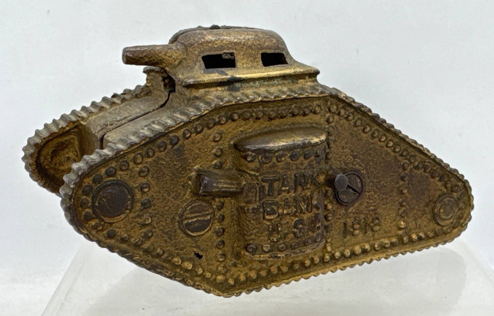 A.C. Williams 1918 Cast Iron Tank Bank: This A.C. Williams cast iron still bank features a detailed tank design with “Tank Bank U.S.A. 1918" embossed on its surface. A collectible nod to early 20th-century craftsmanship, it combines funct