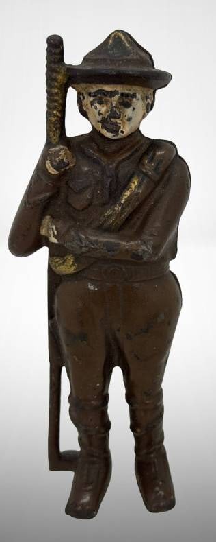 Cast Iron Soldier Still Bank: This cast iron soldier still bank represents a classic form of early 20th-century savings tools. Featuring a detailed military figure holding a rifle, it has a coin slot on the back for saving. Wear c