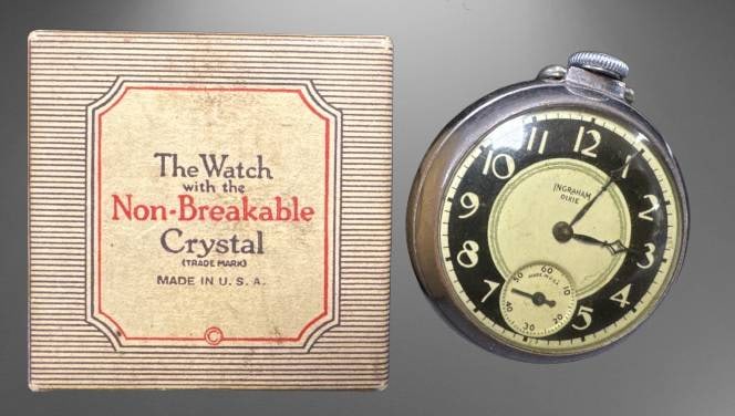 Ingraham Dixie Pocket Watch with Box and Manual: This Ingraham Dixie pocket watch, made in the USA, features its original box and accompanying paperwork, including care instructions. The watch still works and has a black track metal dial protected b