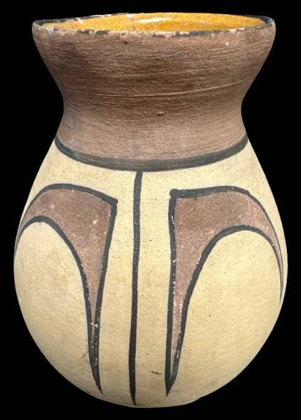 Earthenware Vase with Painted Design: This 5" tall earthenware vase features handpainted motifs in earthy tones. Its shape and design reflect traditional pottery techniques, showcasing cultural artistry. Visible wear suggests its use and