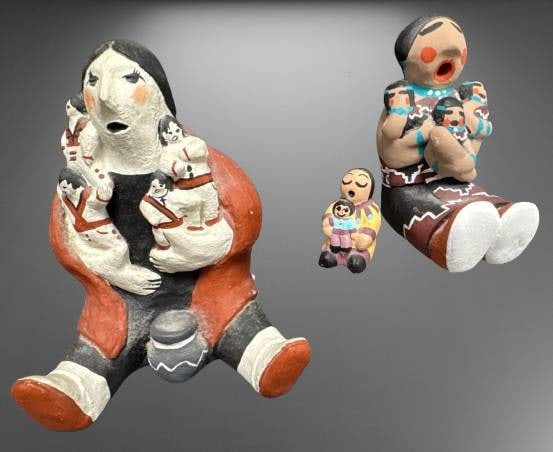 Native American Storyteller Figurines Set: (3) Native American storyteller figurines, each depicting traditional storytelling scenes. Signed by artists Nicketti and MM, with intricate detailing. Smallest piece unsigned. Sizes range from 1"-5" 