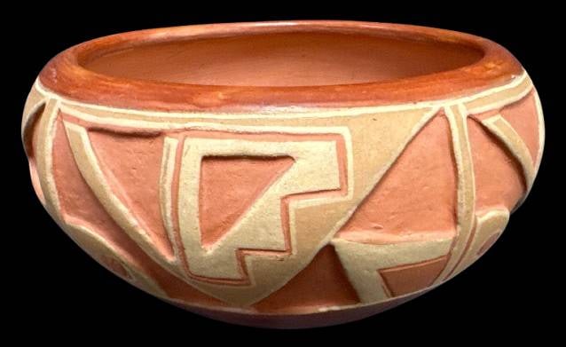 Handcrafted San Juan Pottery Bowl: This San Juan pottery bowl, signed by Tomasita Montoya, showcases traditional designs and fine craftsmanship. It measures approximately 8"d x 4l5"h and features geometric patterns typical of Pueblo po