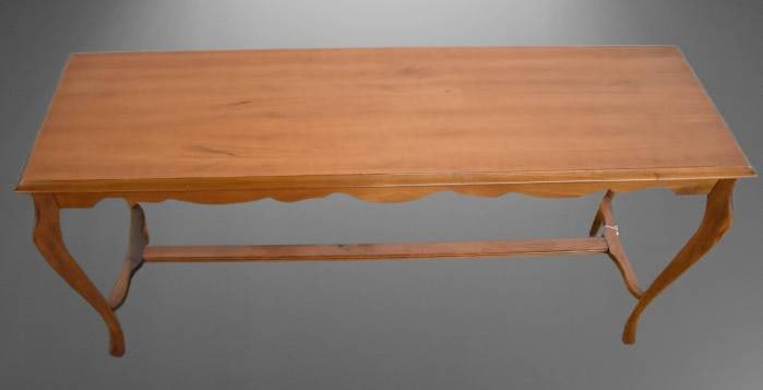 Wooden Console Table With Cabriole Legs: This wooden console table features cabriole legs and a scalloped apron. The table's rectangular surface is supported by stretcher bars, ensuring both stability and style. A versatile and functional pi