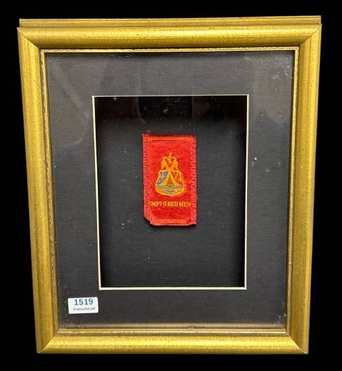 Framed Improved Order of Red Men Textile: Offered is a framed textile featuring the emblem of the Improved Order of Red Men. The artifact includes detailed embroidery and comes housed in a gold-tone frame with backing papers. Historical certi