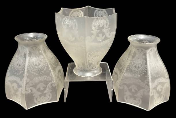 (3) Frosted Glass Lamp Shades: This set comprises (3) frosted glass lamp shades showcasing ornate etched patterns. Each piece exhibits several rim chips as shown in detailed images. These shades are suitable as decorative elements 