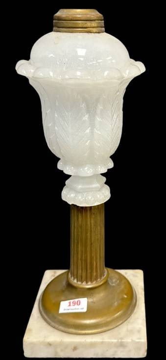 Acanthus Leaf Sandwich Glass Kerosene Lamp: This kerosene lamp features an Acanthus Leaf Sandwich Glass over reeded brass and marble base. Note a chip on the base of the glass body and some typical hits on the marble base. Measures 10.5" tall.