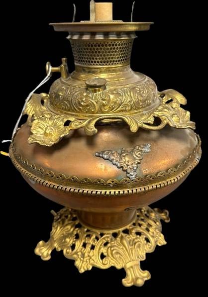 Bradley and Hubbard Brass Parlor Kerosene Lamp: This mrkd. Bradley and Hubbard brass kerosene lamp features extremely ornate details and has been converted for electric use, wired for a c7 size bulb. A seamless blend of antique artistry and functio