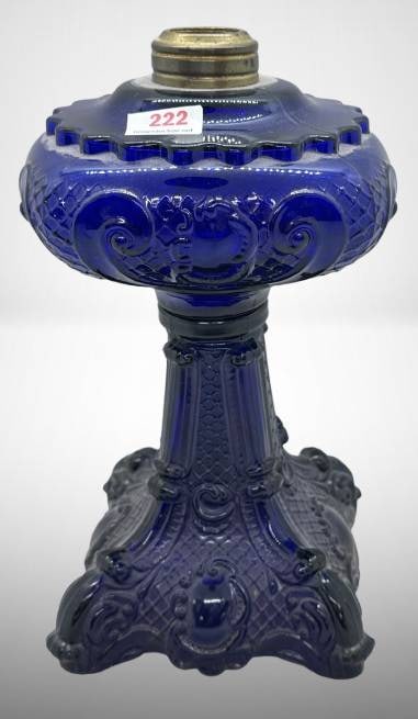Cobalt Princess Feather Kerosene Lamp Base: Offered is a Cobalt Princess Feather kerosene lamp base in excellent condition with no chips, cracks, or repairs. Its intricate detailing and vibrant cobalt hue make it a notable piece of historical c