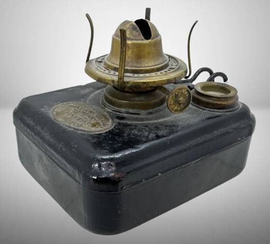Adams and Westlake Kerosene Lamp: This Adams and Westlake kerosene lamp features a sturdy black base and brass burner, with the company’s embossed mark reading ‘Adams & Westlake Company Makers Chicago.’ A fine example of functio