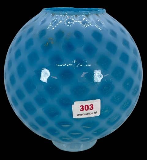 Blue Opalescent Glass Lamp Shade With Diamond Pattern: This blue opalescent glass lamp shade features a diamond-shaped pattern and measures 2.25" in diameter at its base. 6"h ball-shaped. It is free of chips, cracks, or repairs. A striking piece to comple