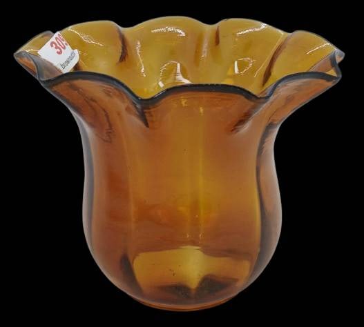 Amber Glass Vase with Black Rim Detailing: Amber glass vase featuring a scalloped rim with black accent detailing. Measuring a base rim diameter of 1 15/16". A versatile decorative piece. In-house shipping available.