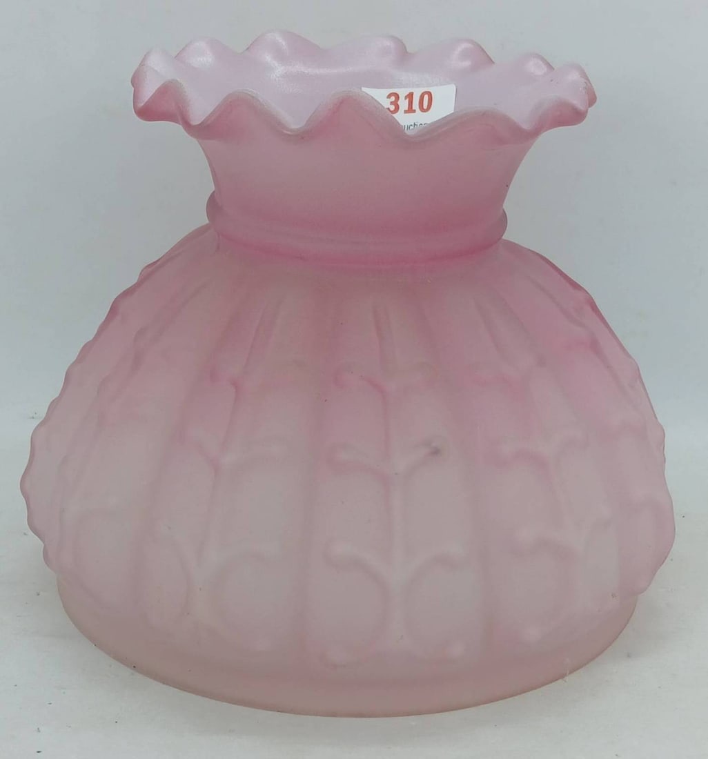 Pink Satin Glass Lamp Shade: Delight in this ribbed pink satin glass lamp shade with a ruffled edge. The shade showcases a textured design with an opening diameter of approximately 2.25 inches. Measures 5" tall with a 5 7/16" mou
