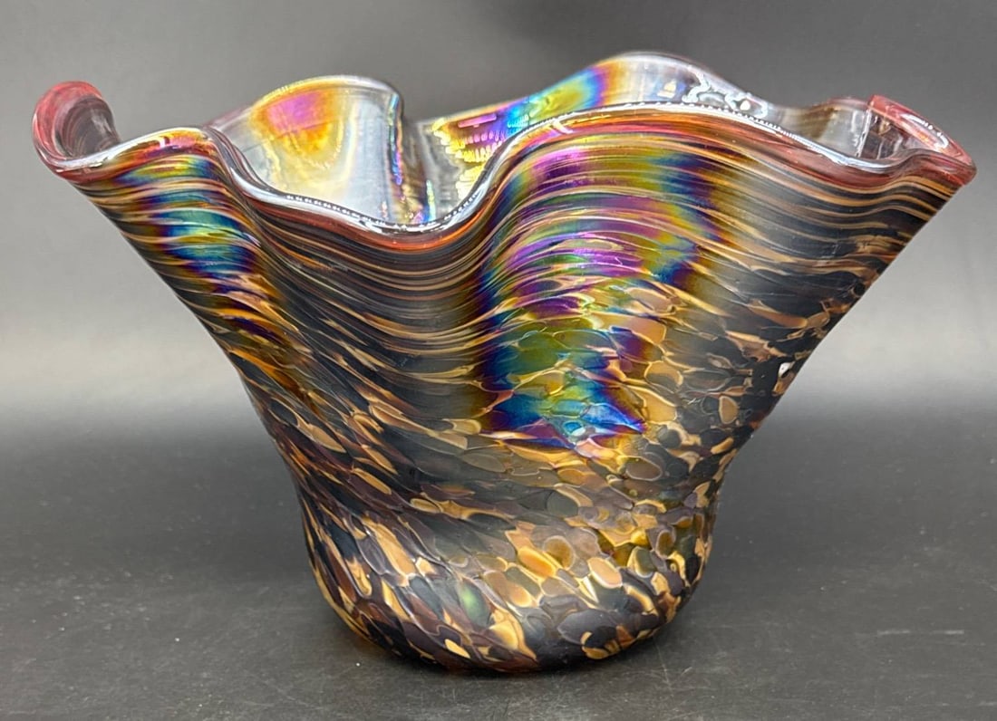 Contemporary Artist-Signed Glass Bowl: 9" tall contemporary artist-signed free-form art glass ruffled bowl featuring a vibrant multicolored pattern. The piece is unique and displays flowing, ruffled edges. In-house shipping available.