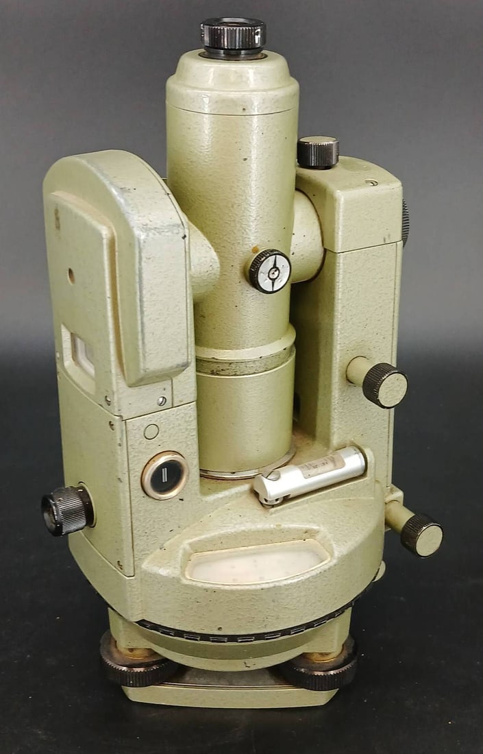 Geotec T-24 Surveyor's Theodolite: Geotec T-24 theodolite, made in Japan, featuring serial number 429340. Constructed from metal with various adjustment knobs. Signs of wear are visible from prior use. In-house shipping available.