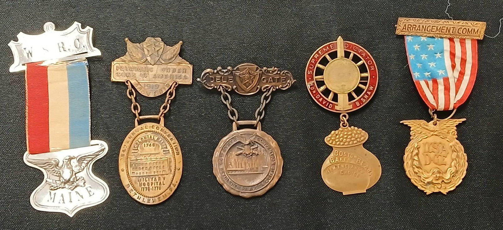 (5) Commemorative Medals and Ribbons: Historical medals and ribbons, including pieces from WSRC Maine and Sons of America, various makers such as Whitehead & Hoag and Bastian Bros., and materials ranging from brass to enamel. Includes pat