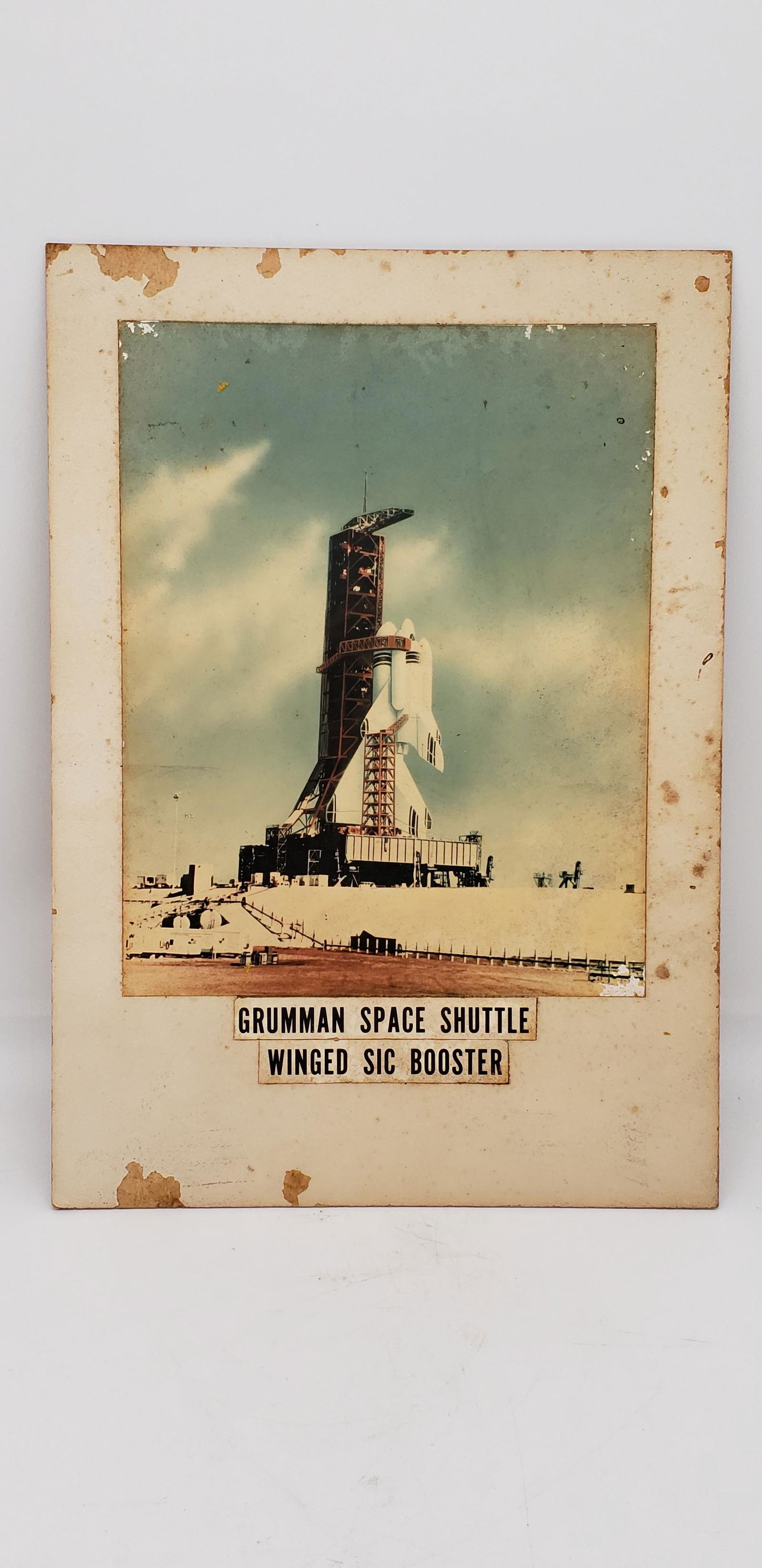 NASA SHUTTLE WINGED SIC BOOSTER: NASA Space Shuttle Winged Sic Booster Manufacturer Grumman Corp Piece is 9 3/4" x 13 1/2" All items are from the Estate of Charles Bell space auction in May of 2000 All items from this Auction Located