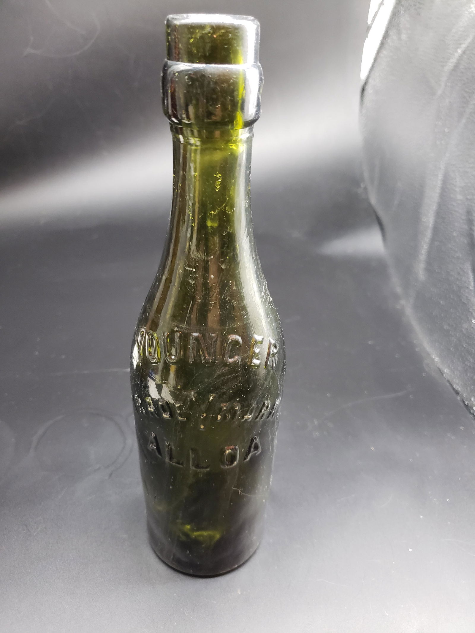 OCEAN FIND YOUNCER TRADEMARK ALLOA BOTTLE: Ocean Find Youncer Trademark Alloa Bottle Piece is 9 1/2" All items from this Auction Located in in Hollywood Florida Warehouse For Shipping Call today for quote they have item numbers and Pak Mail is