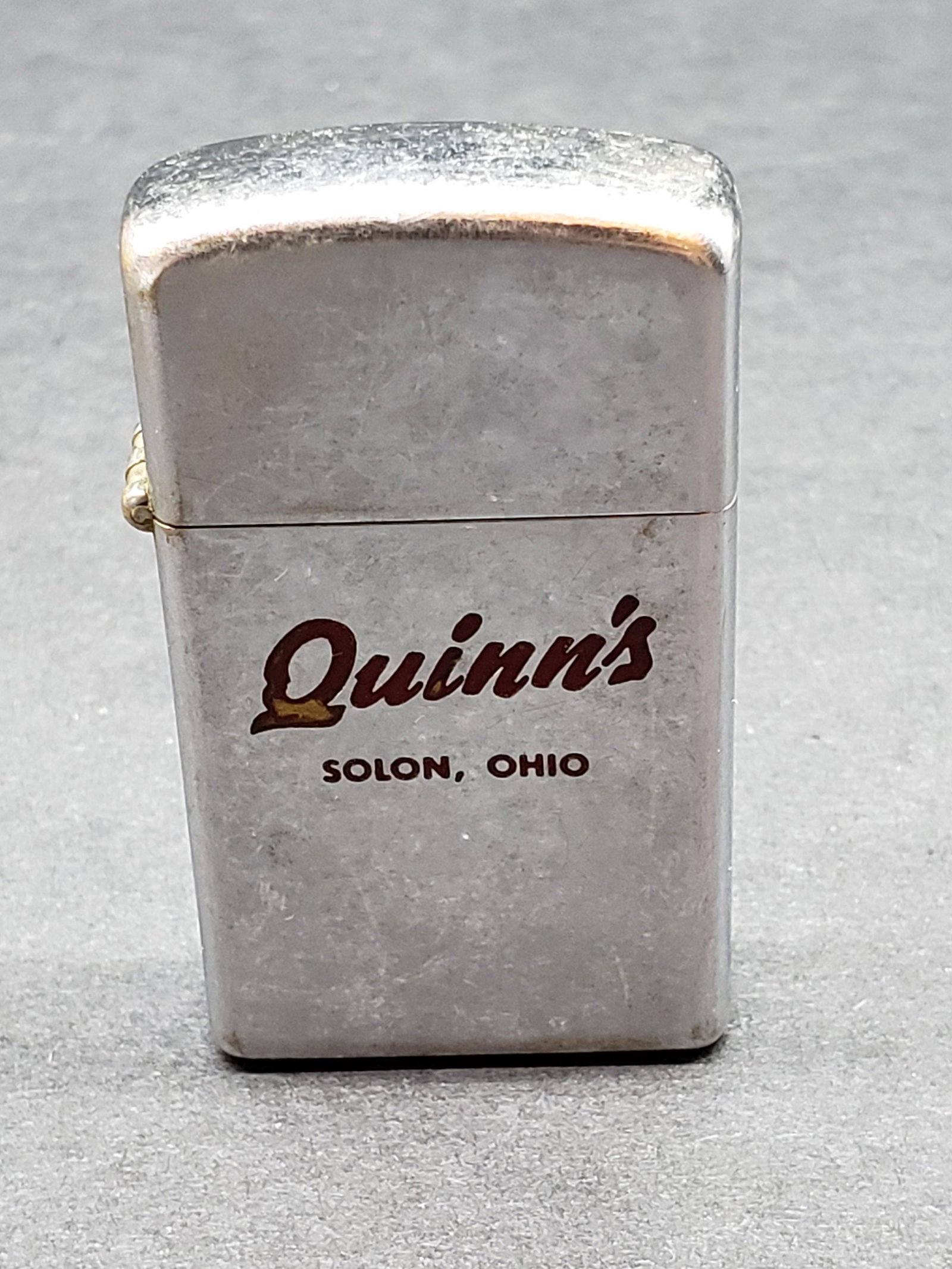 VINTAGE ZIPPO QUINN'S LIGHTER: Vintage Zippo Quinn's Solon Ohio Lighter Piece is 2 1/4" x 1 1/4" All items Located in in Hollywood Florida Warehouse For Shipping Call today for quote they have item numbers and Pak Mail is available
